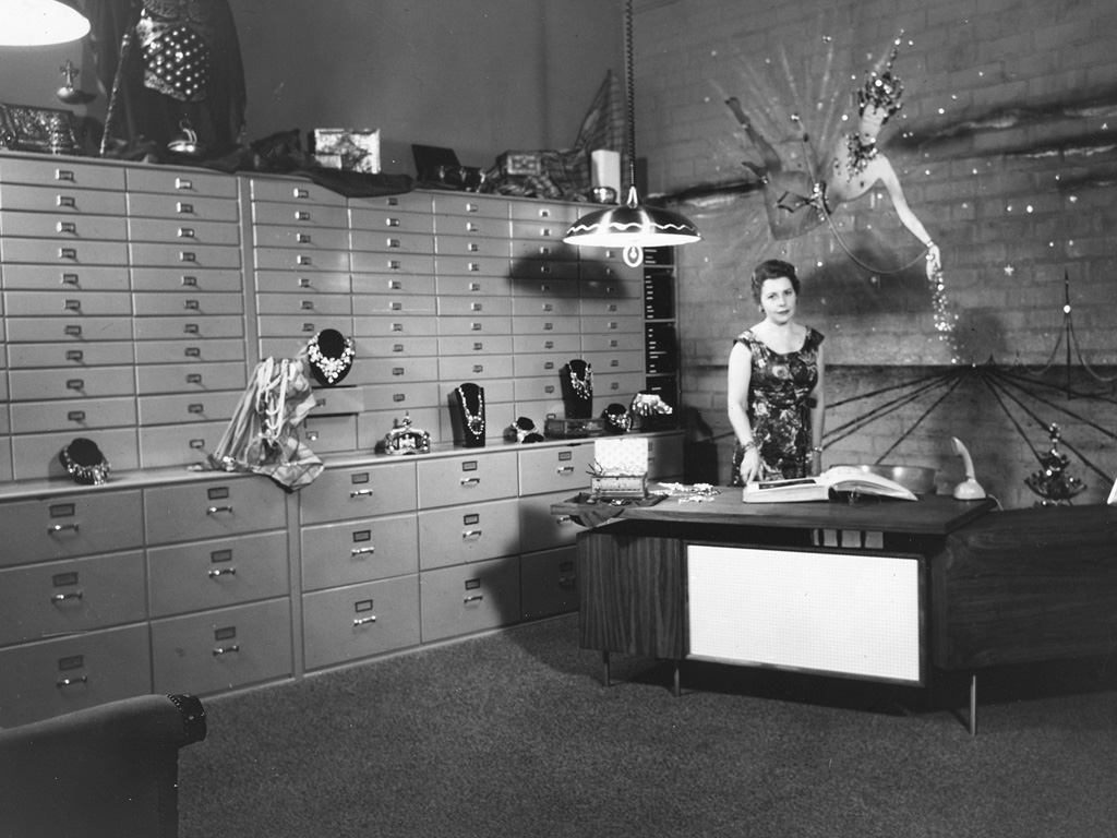 Joan shown at her desk at the Joseff of Hollywood studio in 1953.