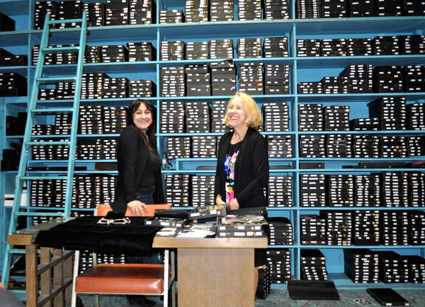 Michele (left) and Tina Joseff stand in front of trays housing thousands of famous jewelry pieces.