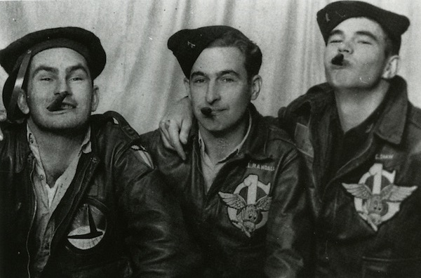 Glider pilots Sam Altman, Frank Randall, and Troy Shaw of the 1st Air Command Group goof around for a photographer in India in 1944. 