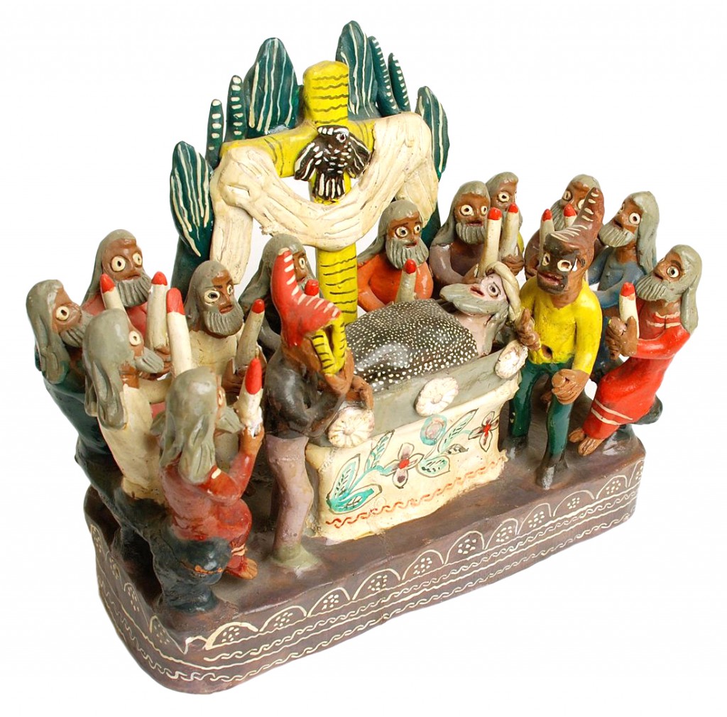 This sculpture seems to show Christ's funeral, observed by the 12 Apostles along with two mysterious, masked figures. Image courtesy Don Lewis.