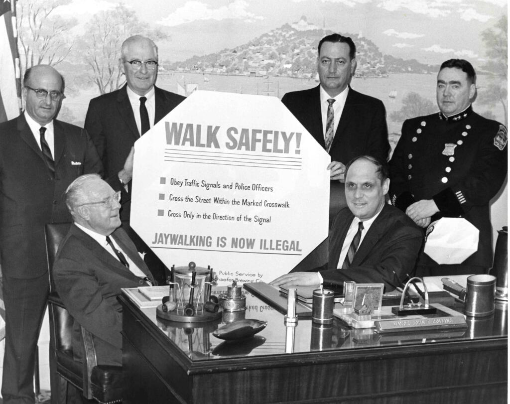 In 1962, Boston formally adopted jaywalking laws to penalize pedestrians, as this photo of city officials shows.